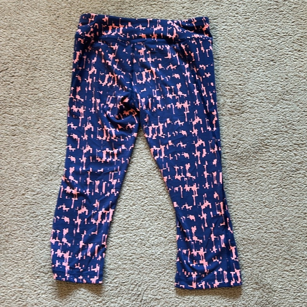 North Face leggings . Size small. Navy/peach. Never worn no rips or pulls.